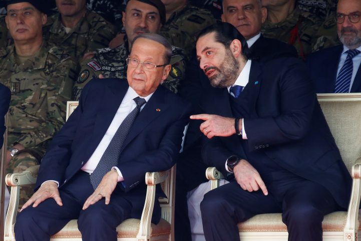 الرئيس اللبناني إلى جانب سعد الحريري/ رويترز