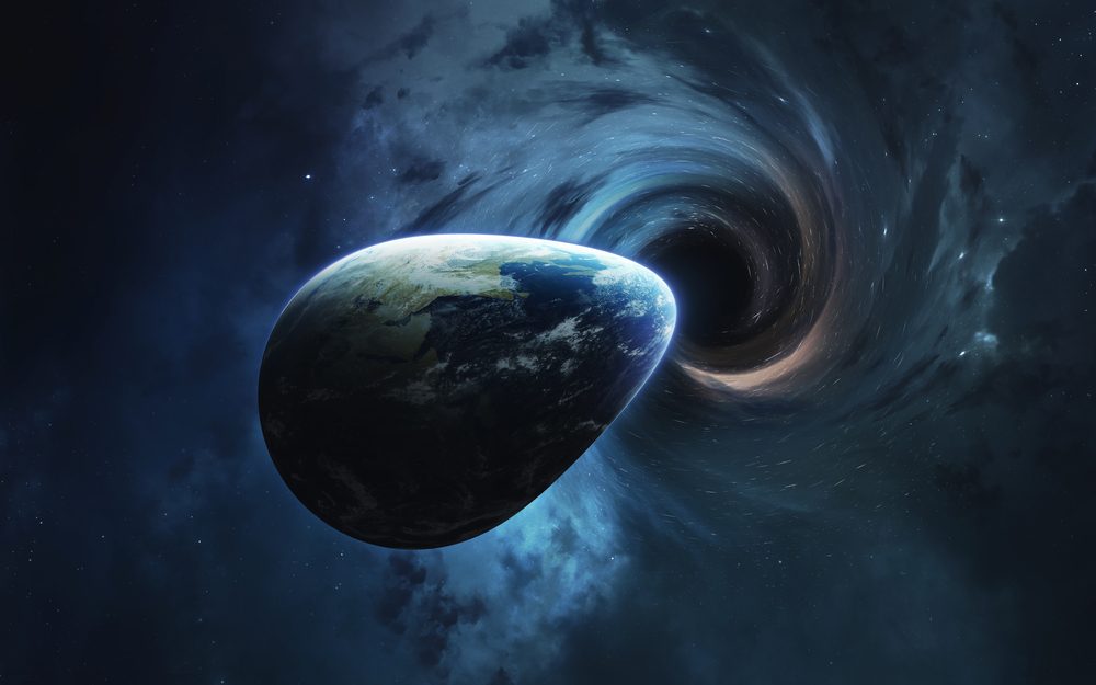ما الذي سيحدث إن ابتلع ثقب أسود كوكب الأرض؟ - ShutterStock